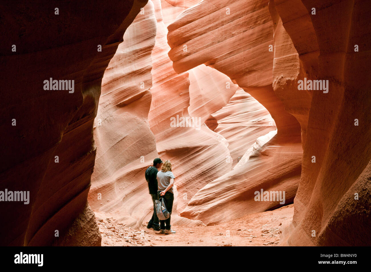 Guide and tourist in Lower Antelope Slot Canyon Page Arizona owned by the Navajo Nation Stock Photo