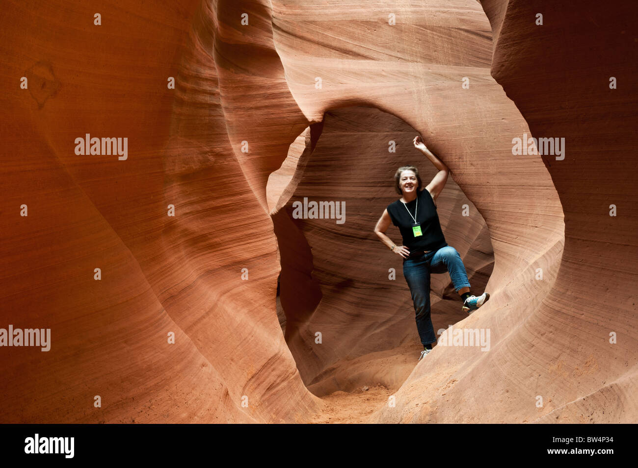 Girl posing in Lower Antelope canyon,  Page Arizona owned by the Navajo Nation Stock Photo