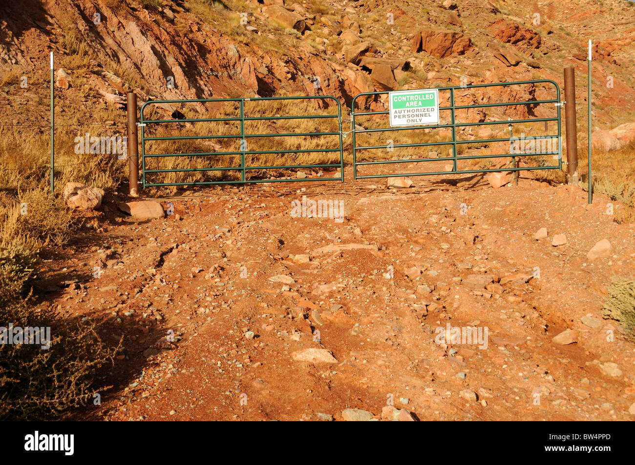 Gate with Restricted Area Notice at Uranium Mine Tailings Clean Up Site Stock Photo