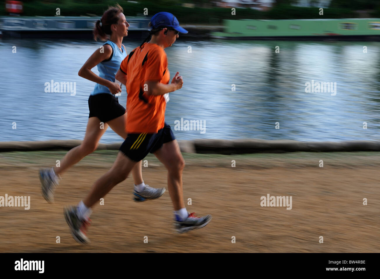 Two Women running a race Stock Photo