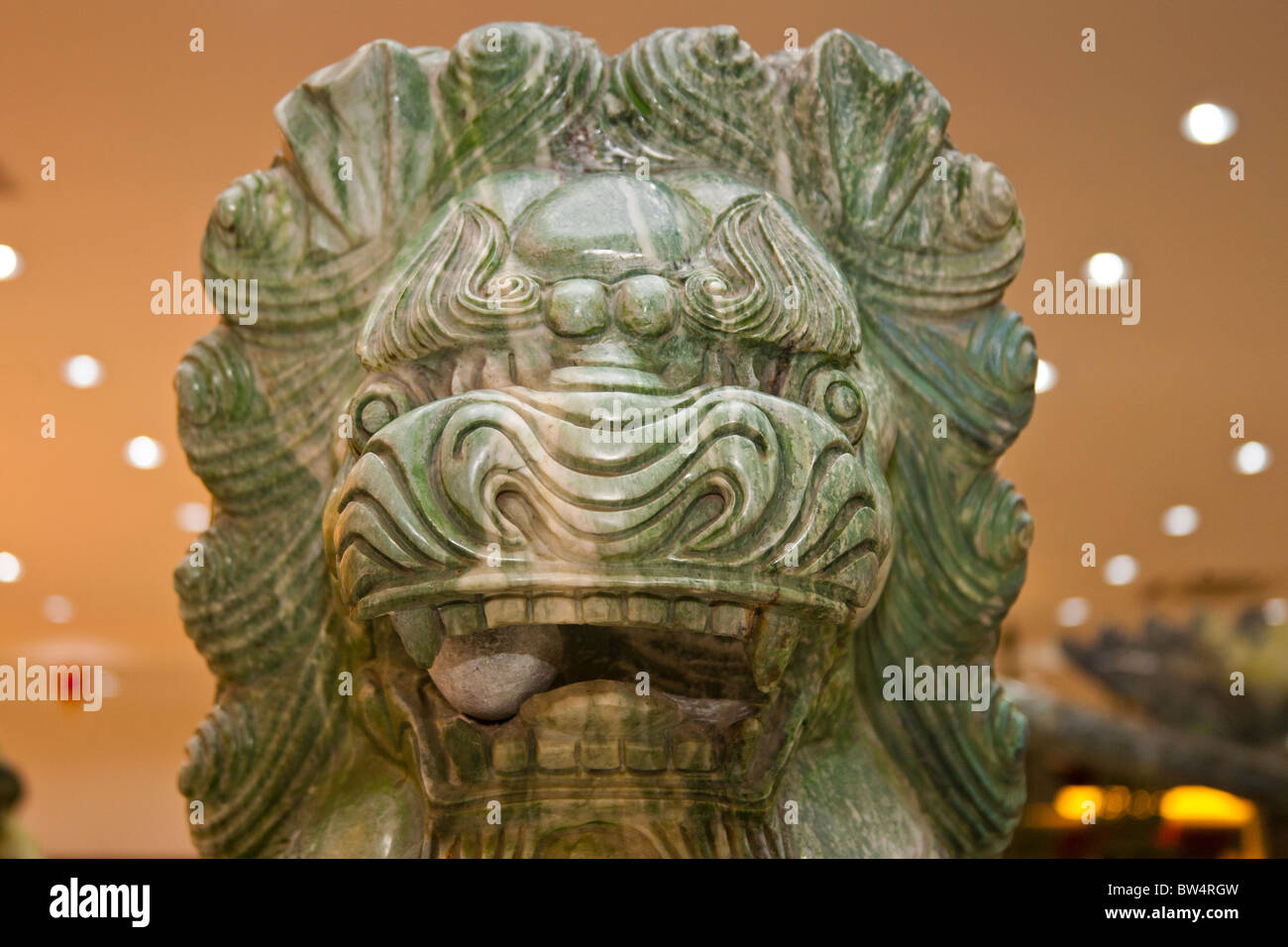 Jade carving of a Chinese lion, displayed in a jade shop, Beijing, China Stock Photo
