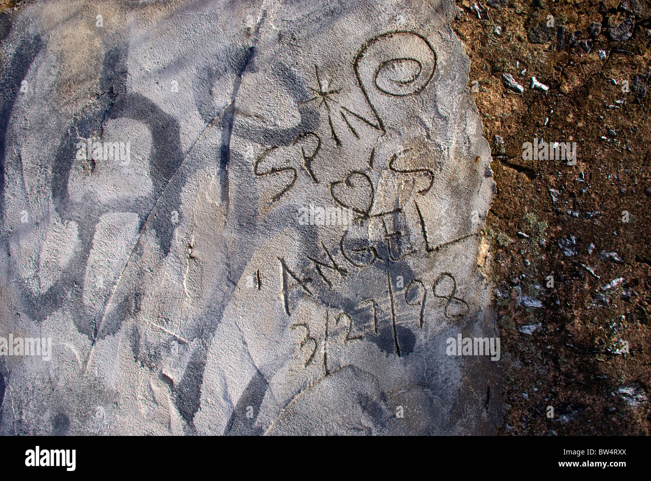 message etched in rough cement and concrete texture Stock Photo