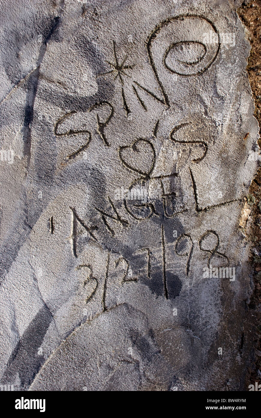 message etched in rough cement and concrete texture Stock Photo
