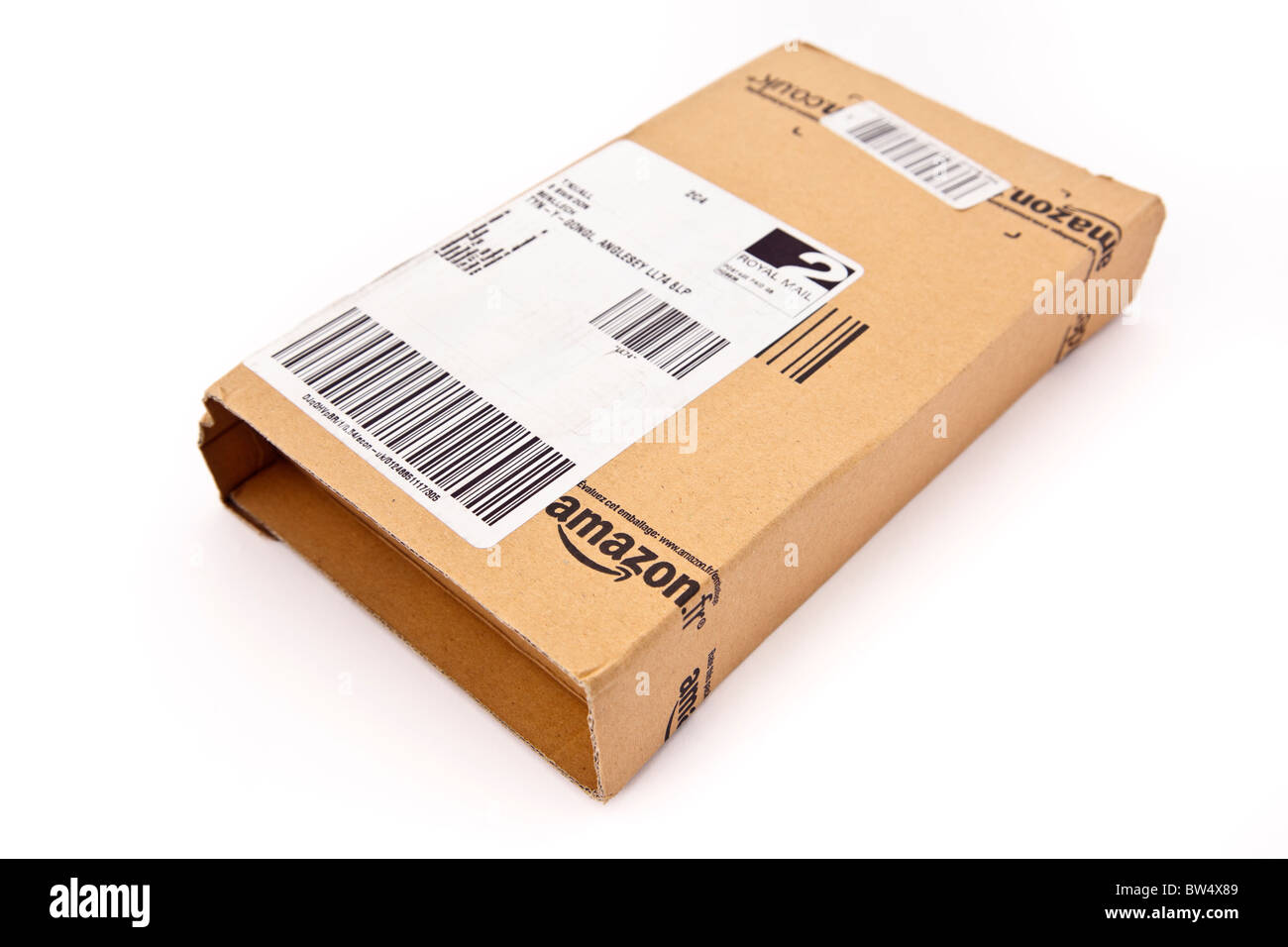 Cardboard package parcel box from Amazon isolated on a white background. Online shopping on internet. UK Stock Photo