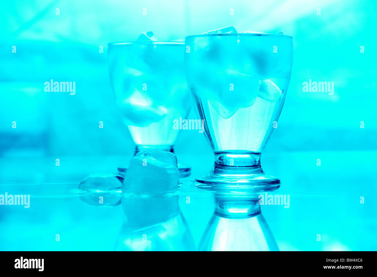 Blue image of two glasses of water with ice Stock Photo - Alamy