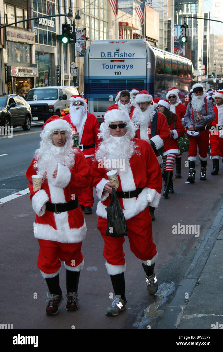 Costumed Santa Claus Revelers Celebrate Annual NYC SANTACON Bar Crawl Stock Photo