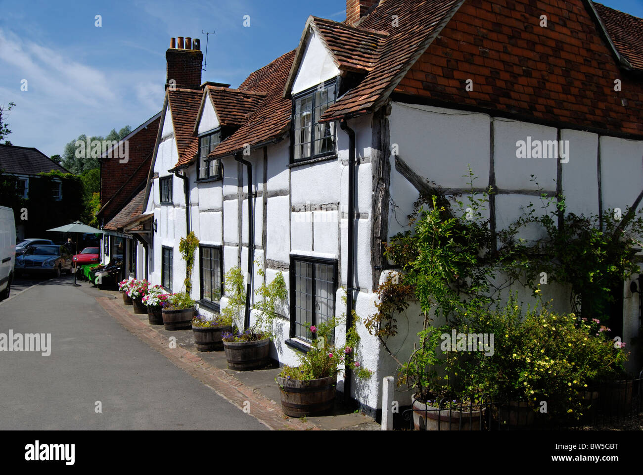 Half timbered whitewashed cottages shere near hires stock photography
