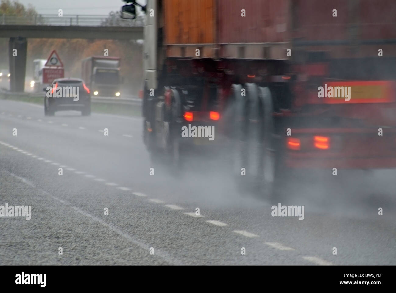 Lorry Driving in Rain Stock Photo