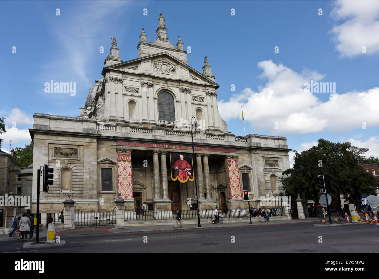 Full frontal elevation of the Brompton Oratory viewed from Thurloe Place,the drop down banner is of Cardinal Newman. Stock Photo