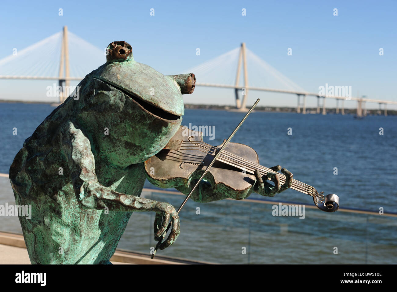 Art frog with fiddle in front of Arthur J. Ravenel bridge, Charleston