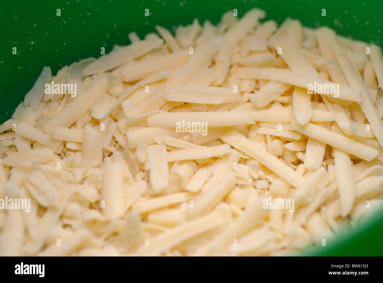 https://c8.alamy.com/comp/BW61G3/grated-cheese-in-a-container-BW61G3.jpg