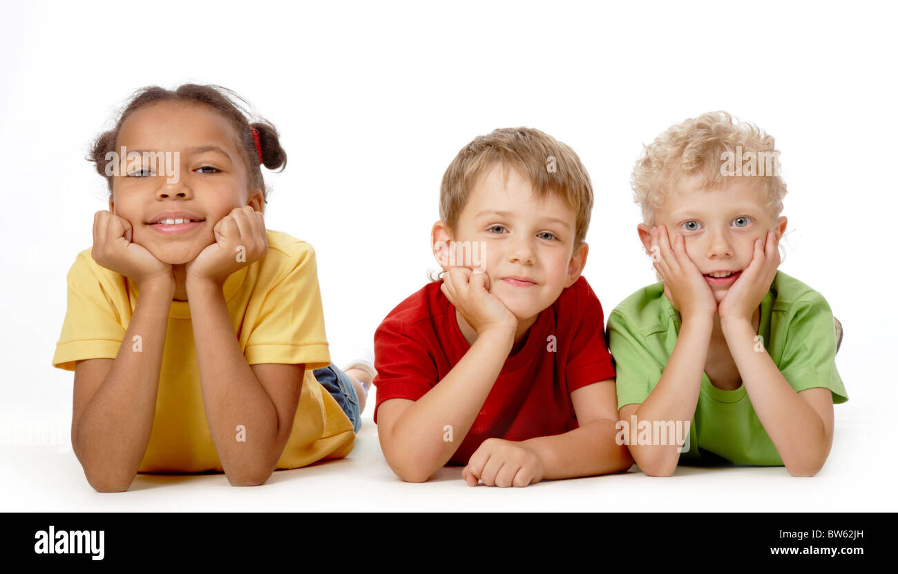 Image of funny children lying down and posing to camera Stock Photo
