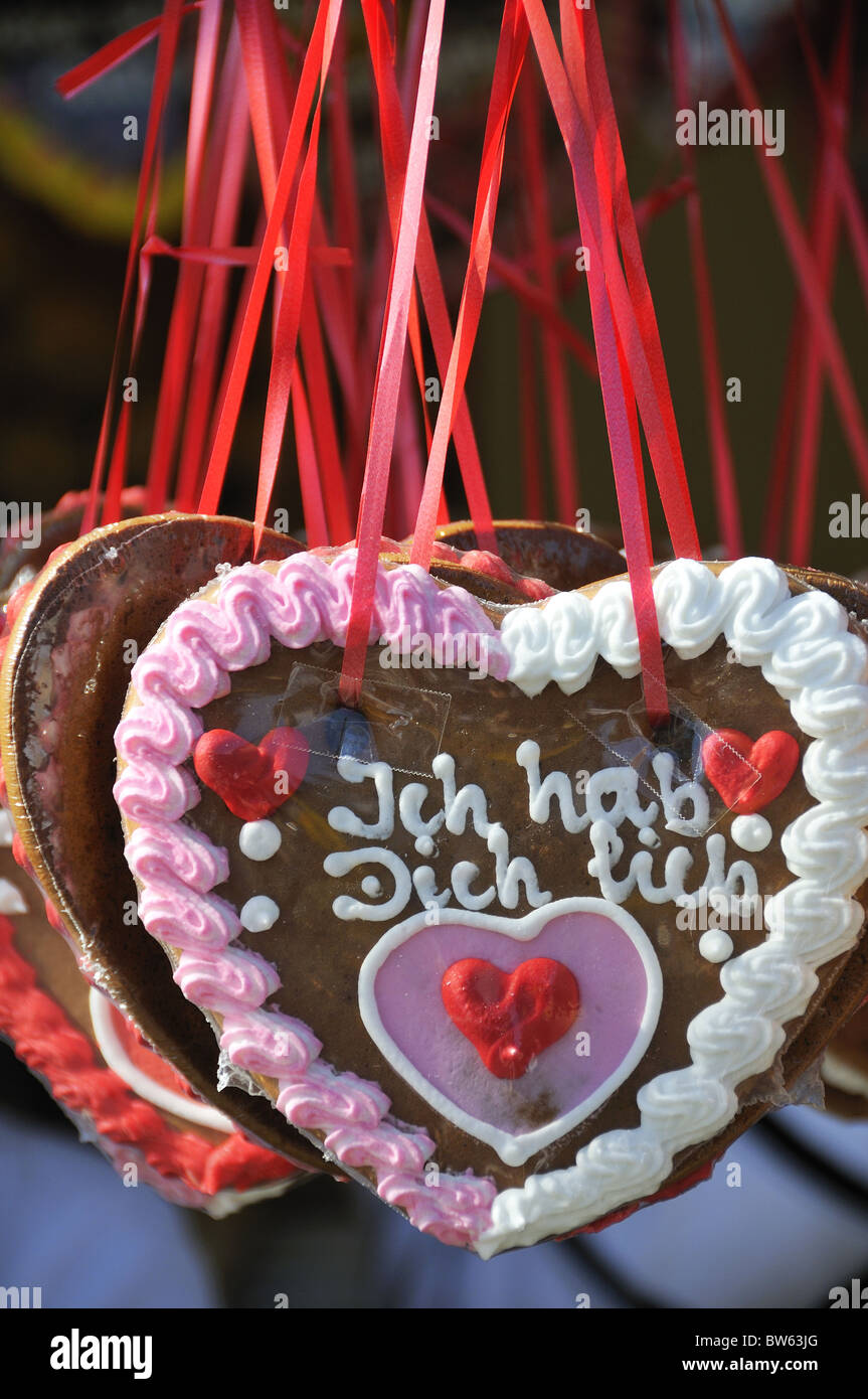 Chocolate and gingerbread hearts hung on ribbons with words 'ich hab dich lieb' taken at wine festival in Bad Durkheim, Germany Stock Photo