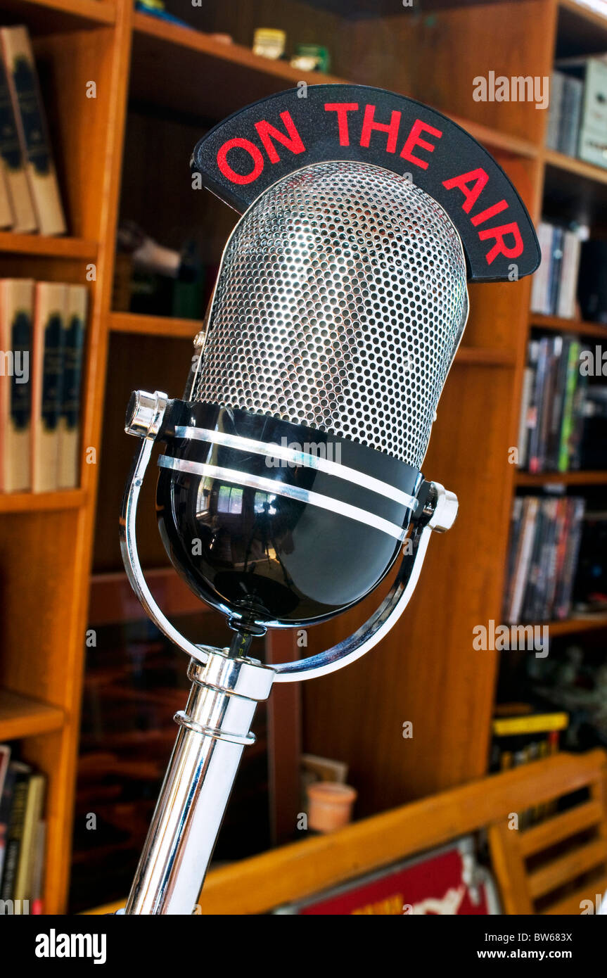 Old fashioned radio studio microphone with illuminated on the air sign Stock Photo