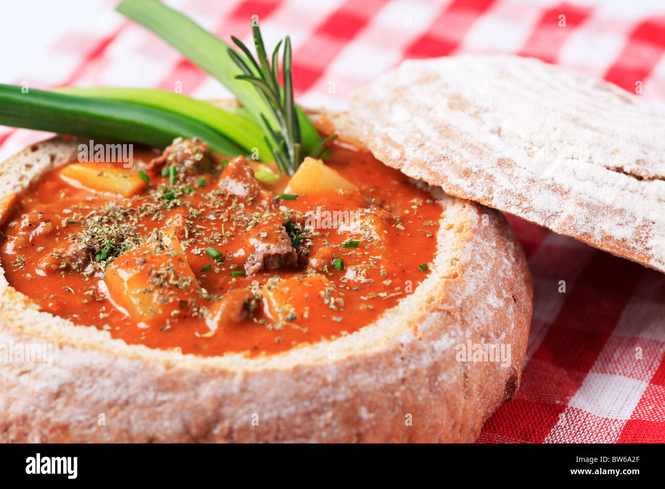 Goulash in a bread bowl Stock Photo Alamy