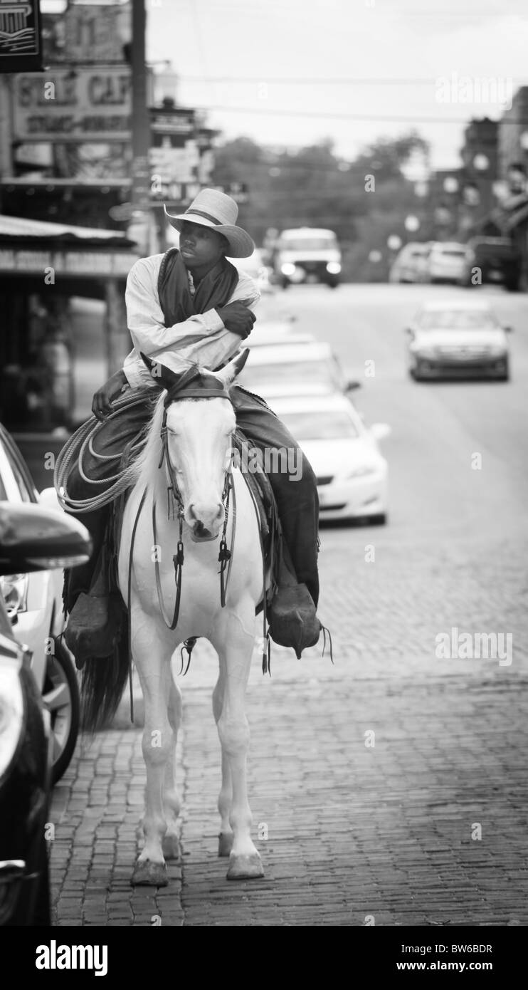 Cowboy riding through the Stock Yards at Fort Worth, Texas Stock Photo