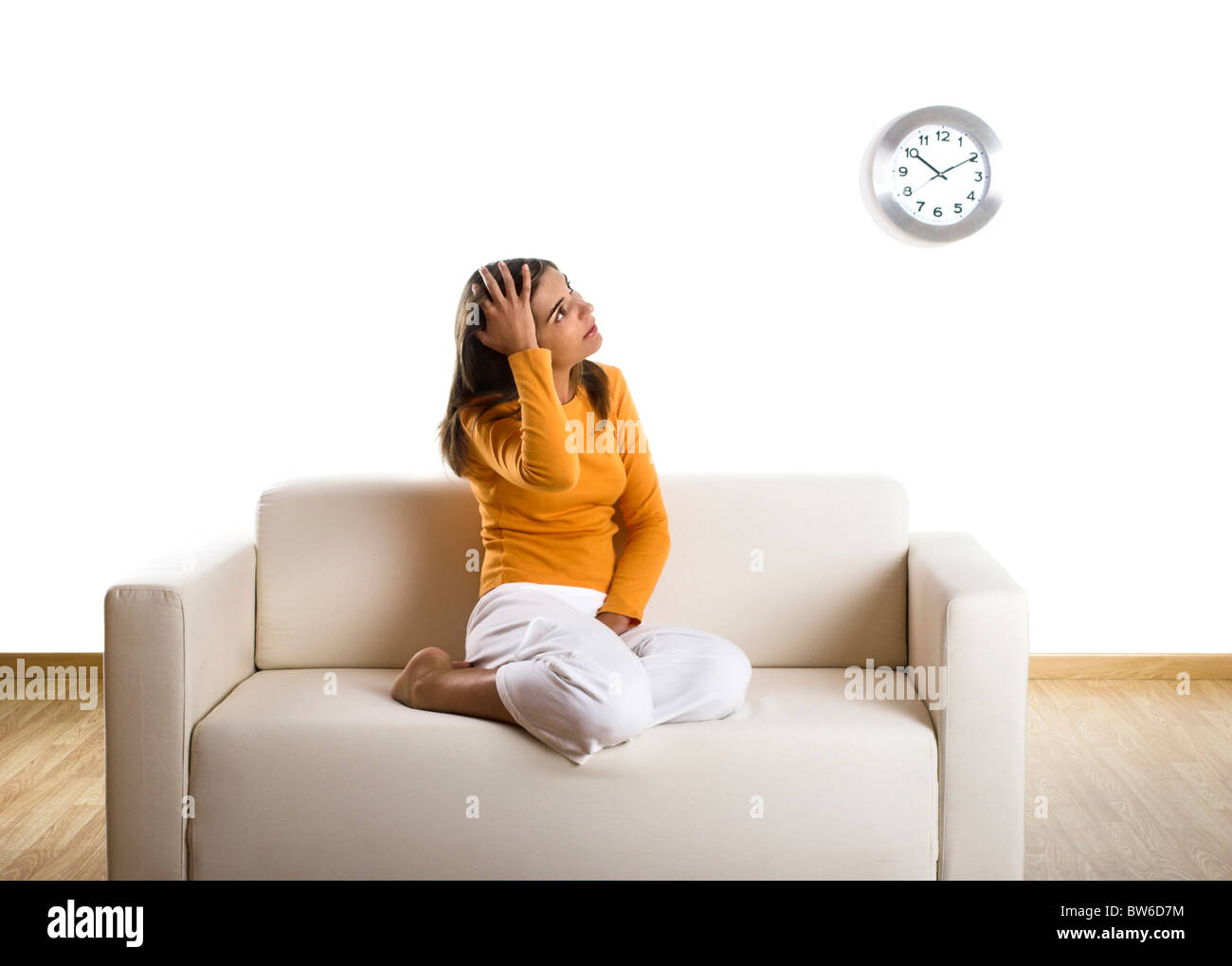 Beautiful woman relaxing on the couch at home Stock Photo - Alamy