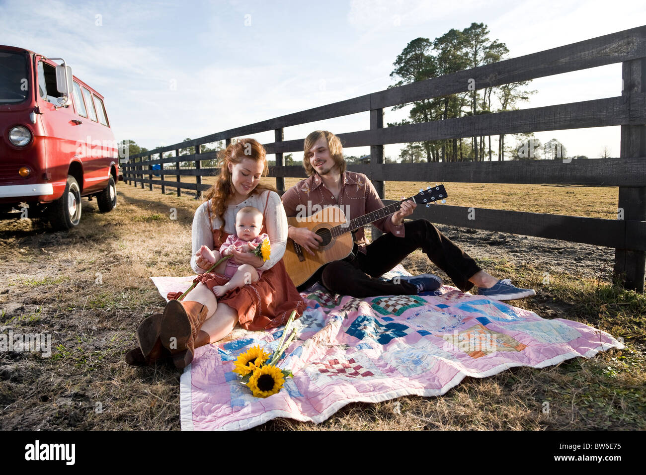 Young rural family relaxing on farm Stock Photo