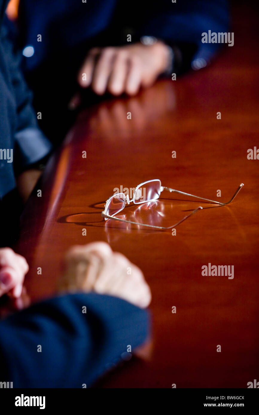 Eyeglasses on board room table Stock Photo