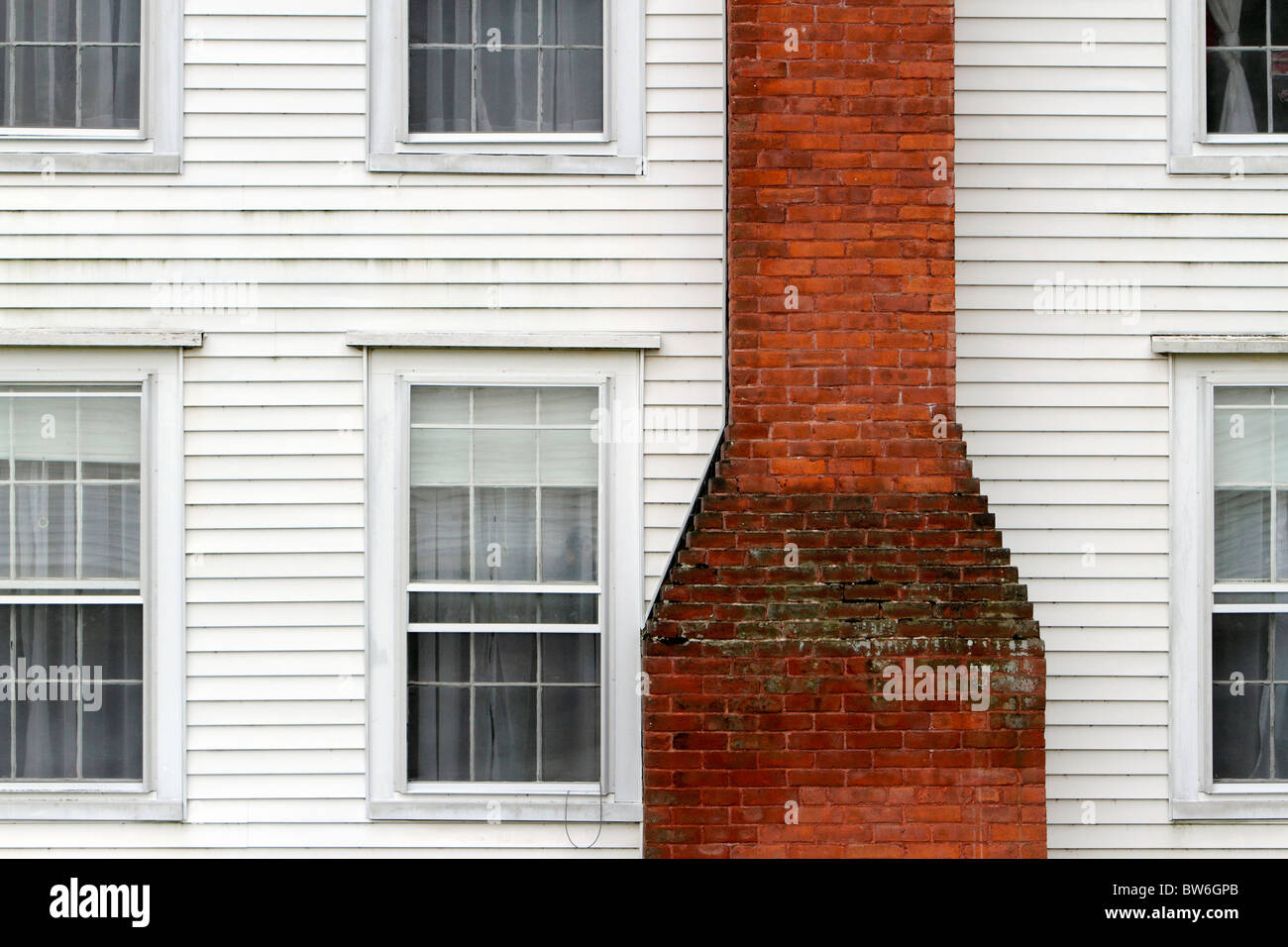 New England white clapboard house brick chimney Stock Photo
