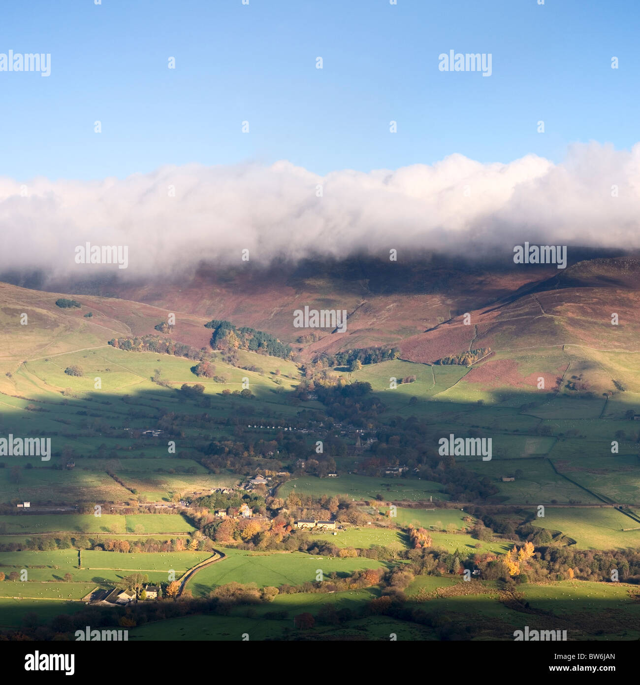 Low cloud hangs over The hilltops of The Vale Of Edale near Castleton Derbyshire Peak District UK square panoramic Stock Photo