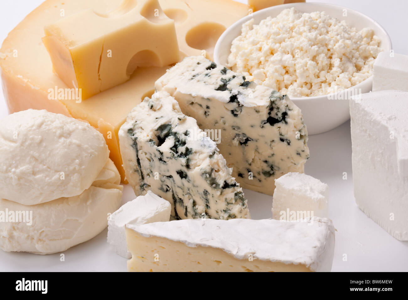 Various types of cheeses on a white background. Stock Photo
