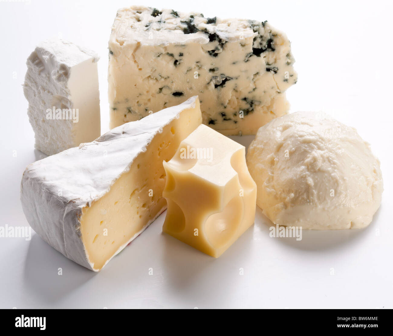 Various types of cheeses on a white background. Stock Photo
