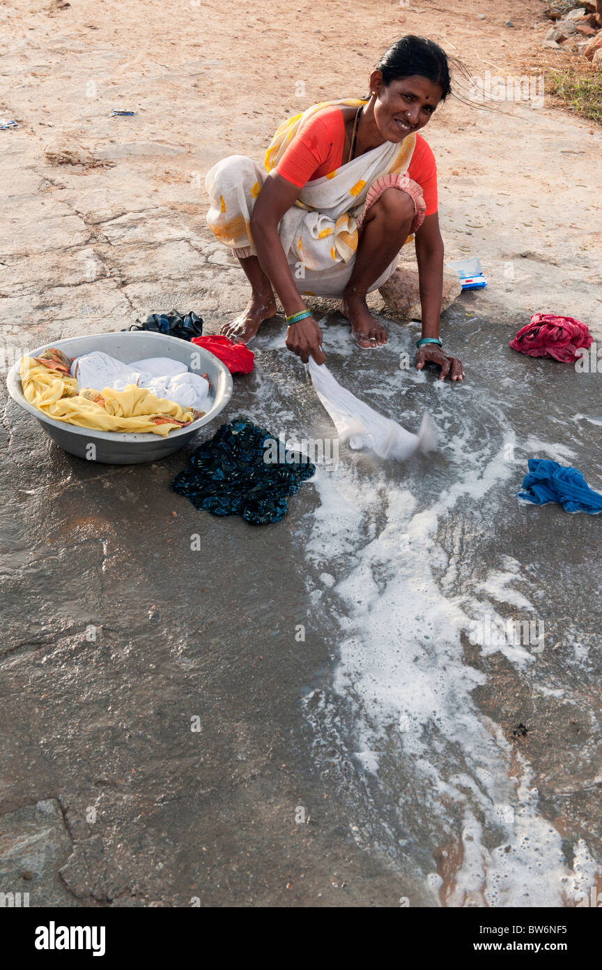 https://c8.alamy.com/comp/BW6NF5/indian-woman-washing-clothes-by-hand-next-to-a-river-andhra-pradesh-BW6NF5.jpg