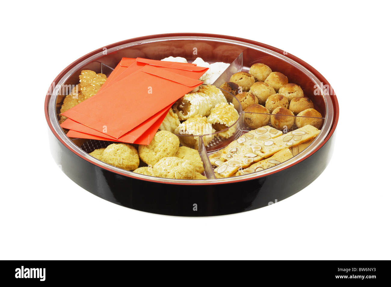 Chinese new year cookies and red packets in gift tray Stock Photo