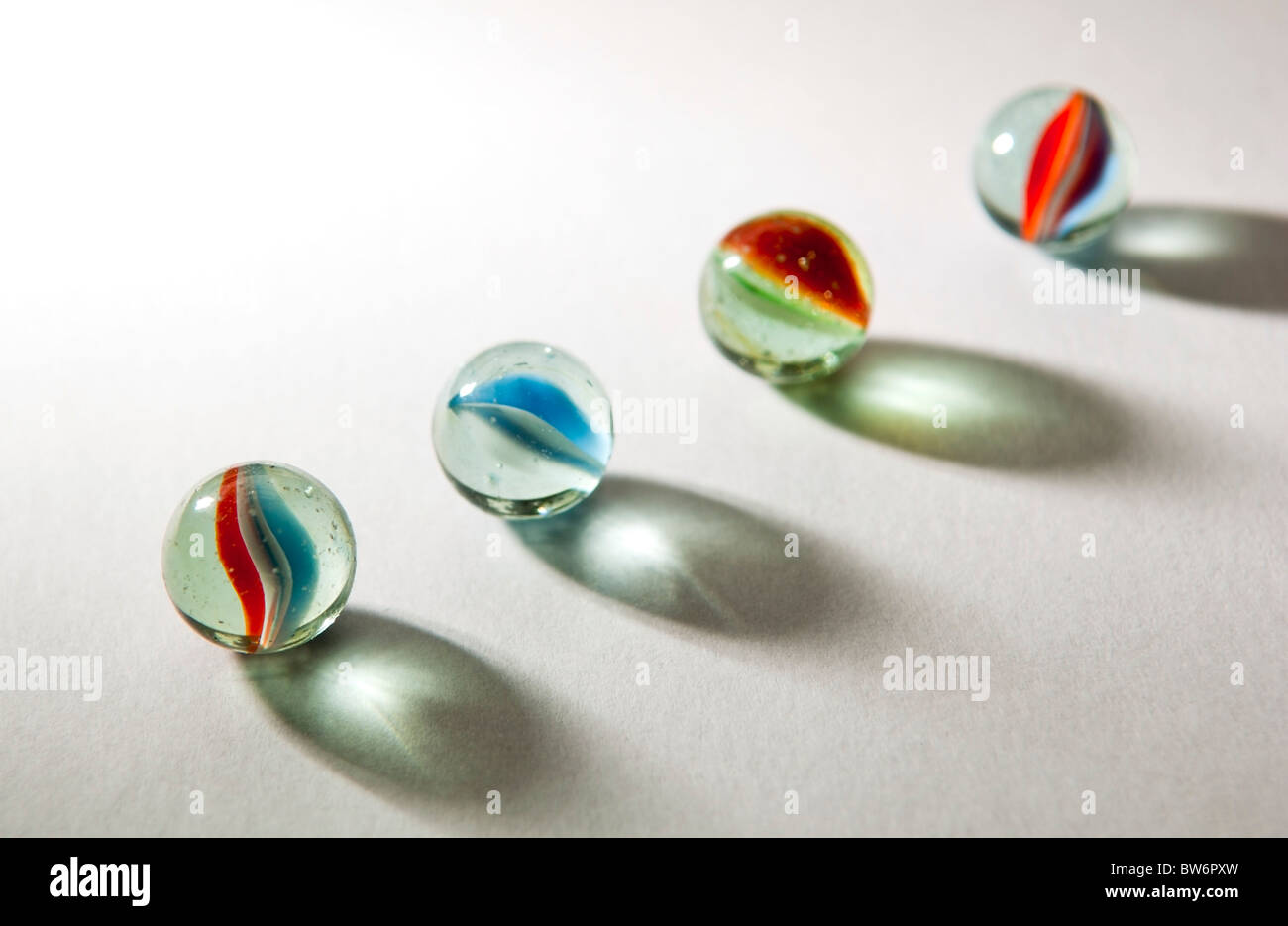 Brightly colored marbles in different shades with deliberately long