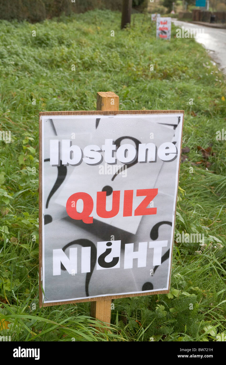 a roadside verge sign giving notice of a village quiz night at Ibstone Buckinghamshire UK. Stock Photo