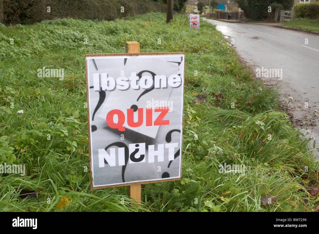 a roadside verge sign giving notice of a village quiz night at Ibstone Buckinghamshire UK. Stock Photo