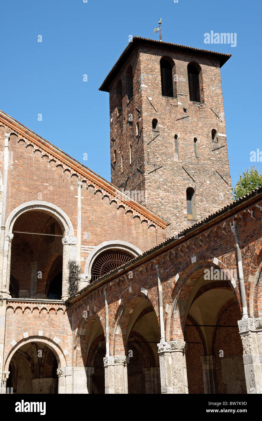 Detail of the bell tower and the cloister of the Church of Saint Ambrose (Sant'Ambrogio) in Milan. Stock Photo