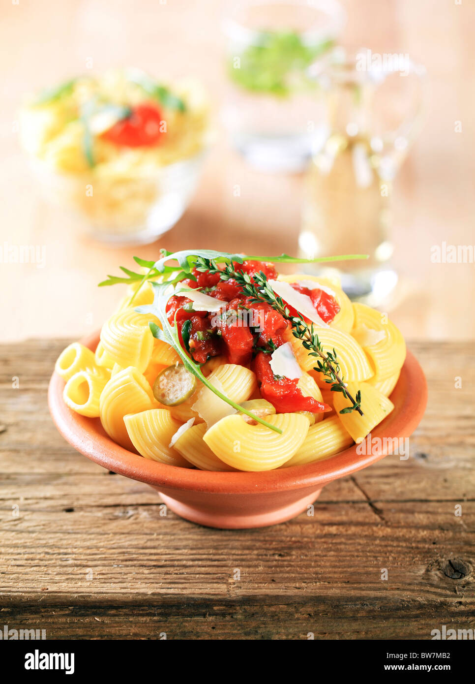Macaroni with crushed tomatoes, capers and Parmesan Stock Photo Alamy