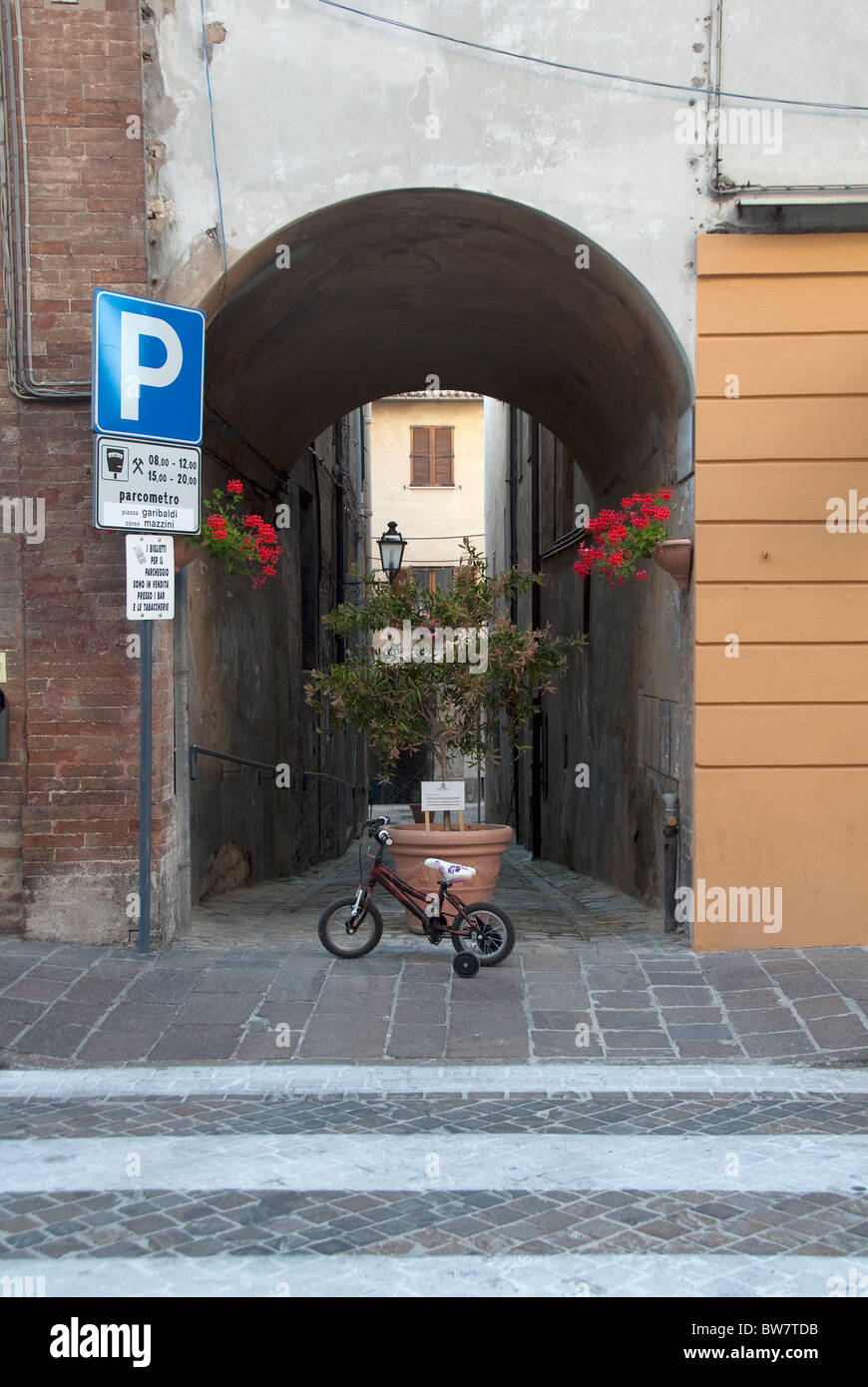 Child's bicycle in Arcevia, Le Marche, Italy Stock Photo