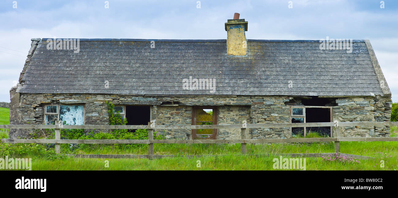 Derelict old period stone cottage rundown and in need of renovation, County Clare, Ireland Stock Photo