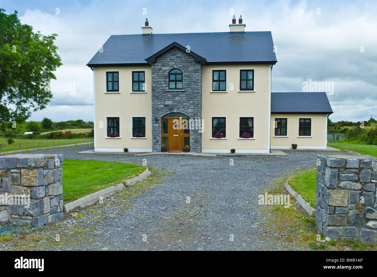 New modern house, typical of extensive new development in Ireland, at Curragh West, County Galway, Ireland Stock Photo
