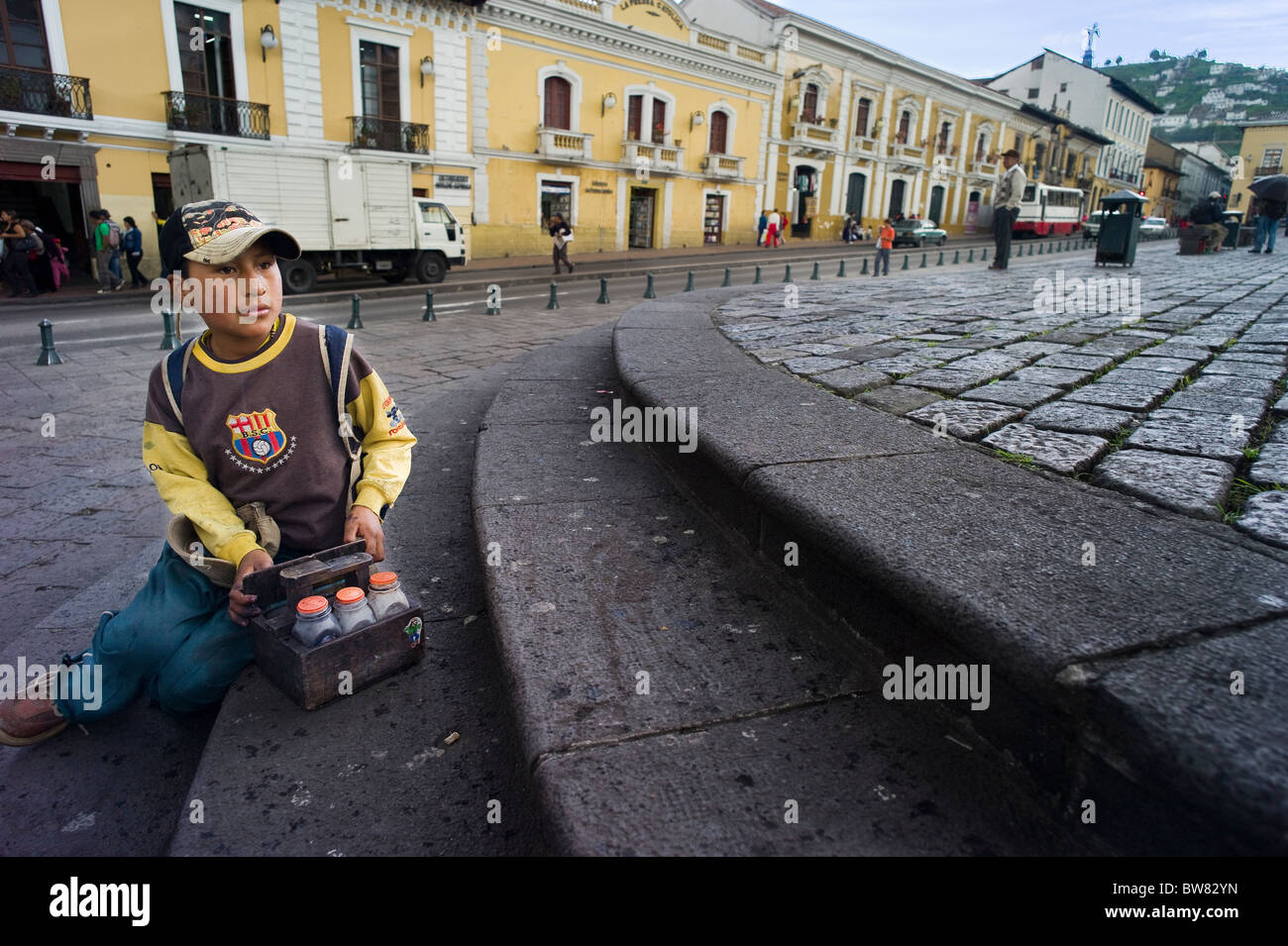 Shoeshine boy in Plaza San Francisco, Quito, Ecuador Stock Photo