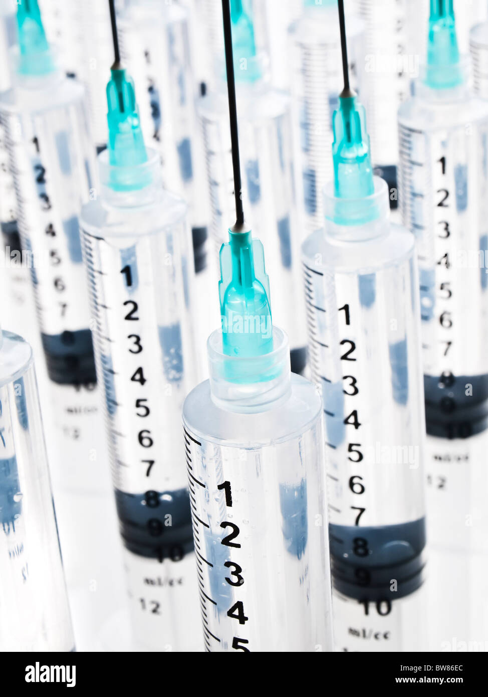 Multiple rows of syringes Stock Photo