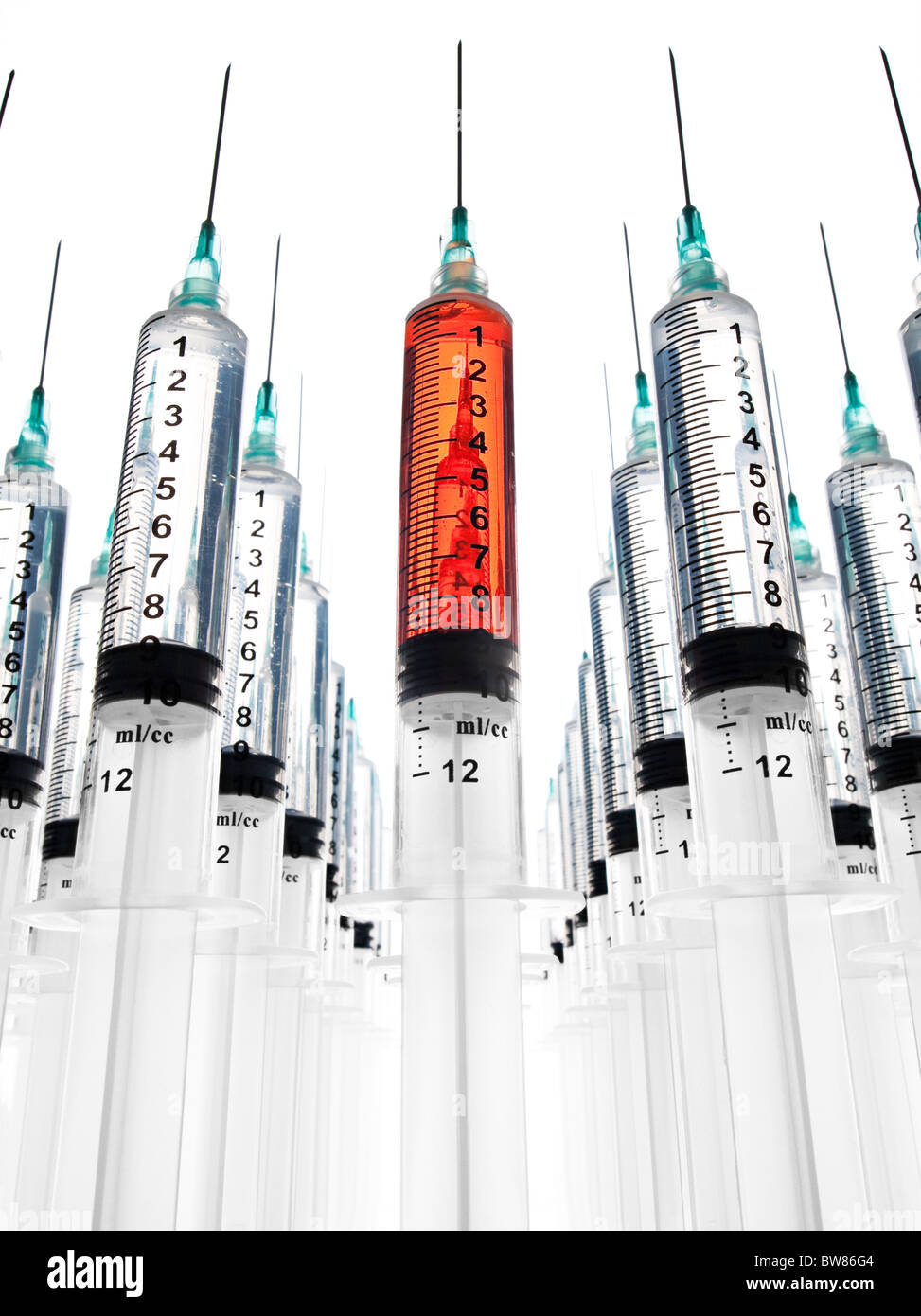 Multiple rows of syringes, one filled with blood Stock Photo