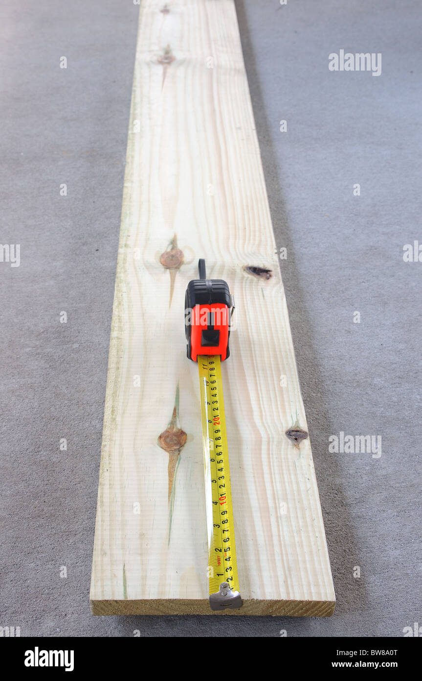 Wood plank and tape measure Stock Photo Alamy