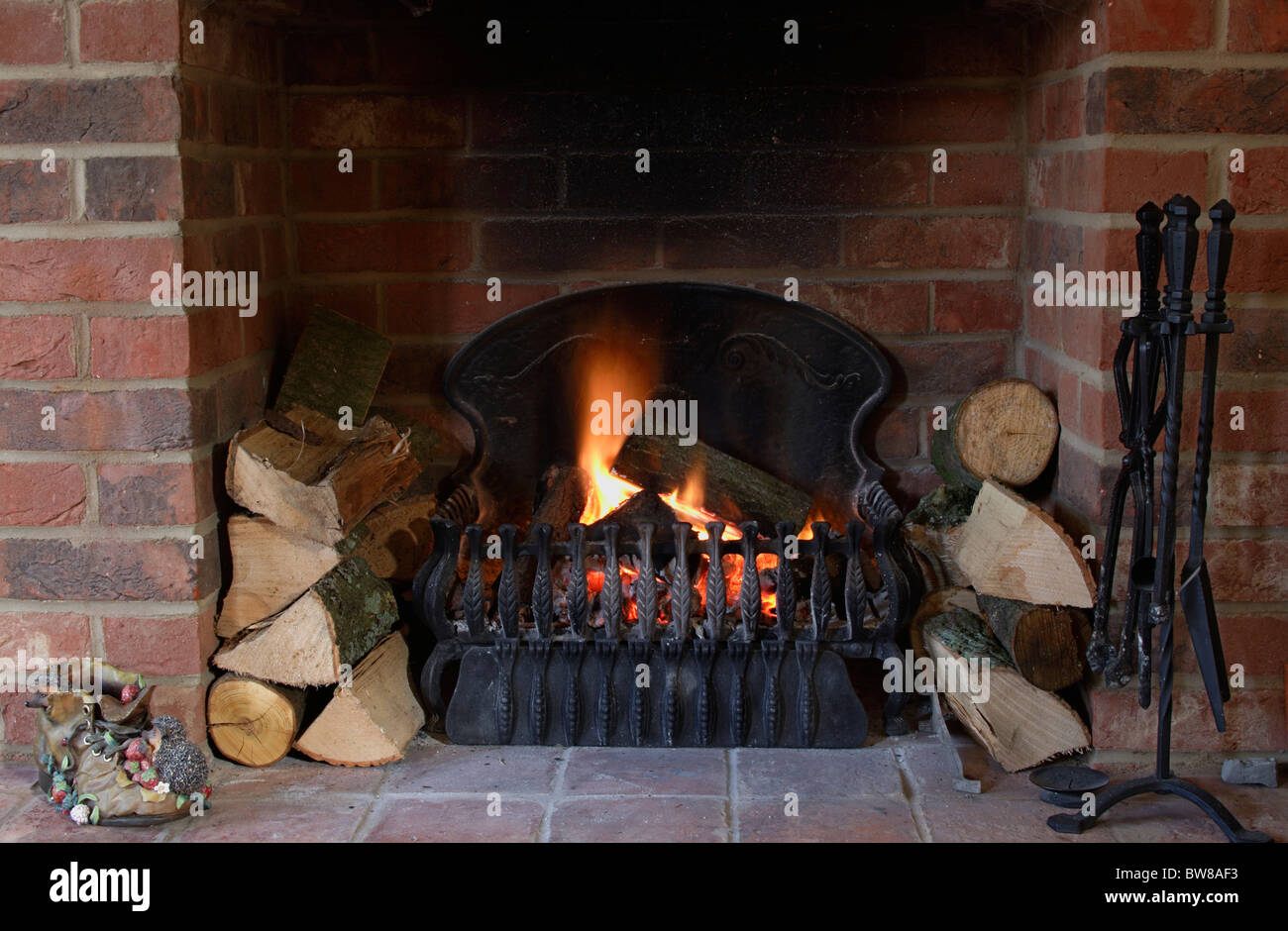 Wood burning in fire place Stock Photo - Alamy