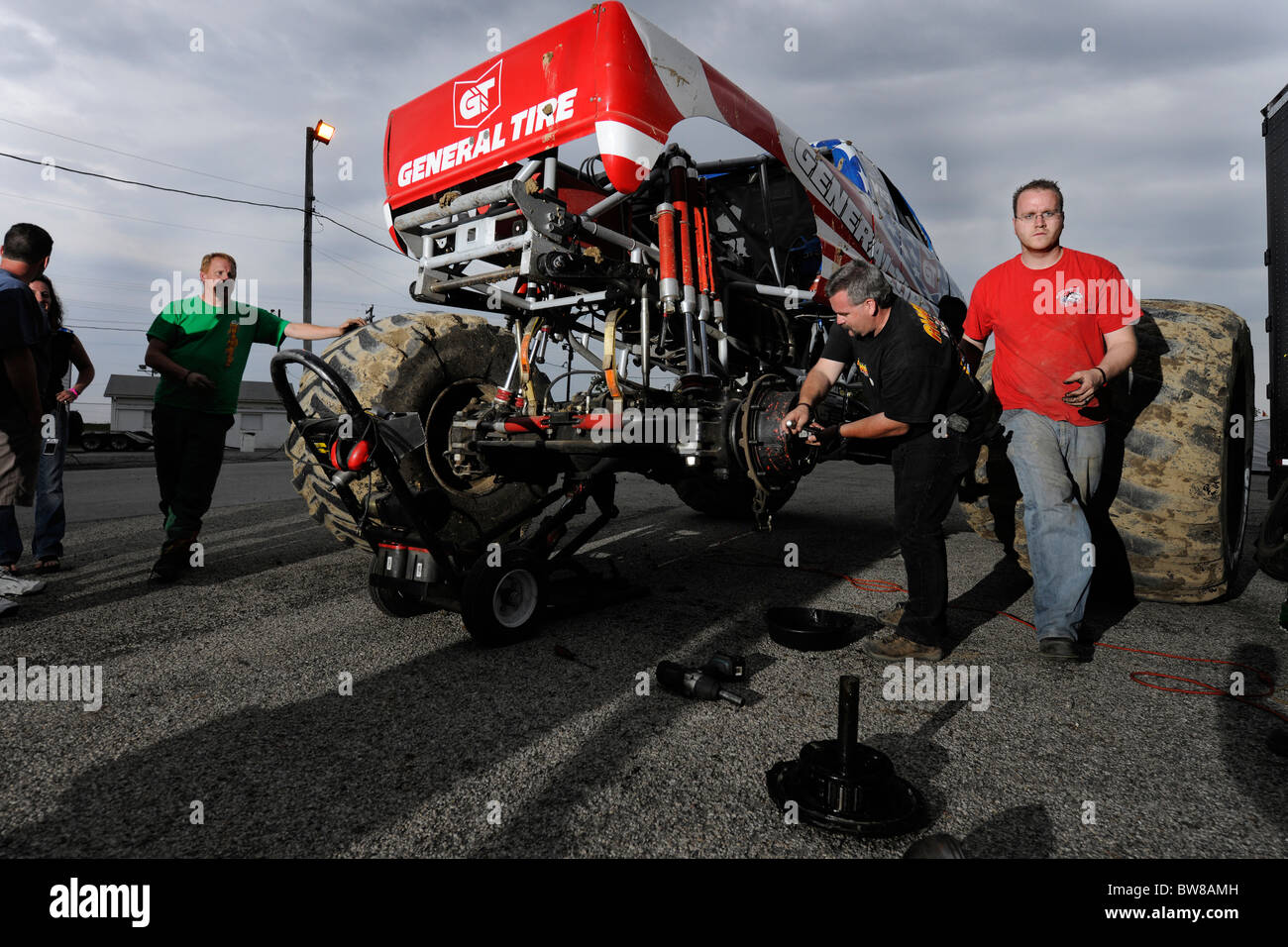 Fixing broken axle for freestyle competition at 4x4 Off-Road Jamboree Monster Truck Show at Lima, Ohio. Stock Photo
