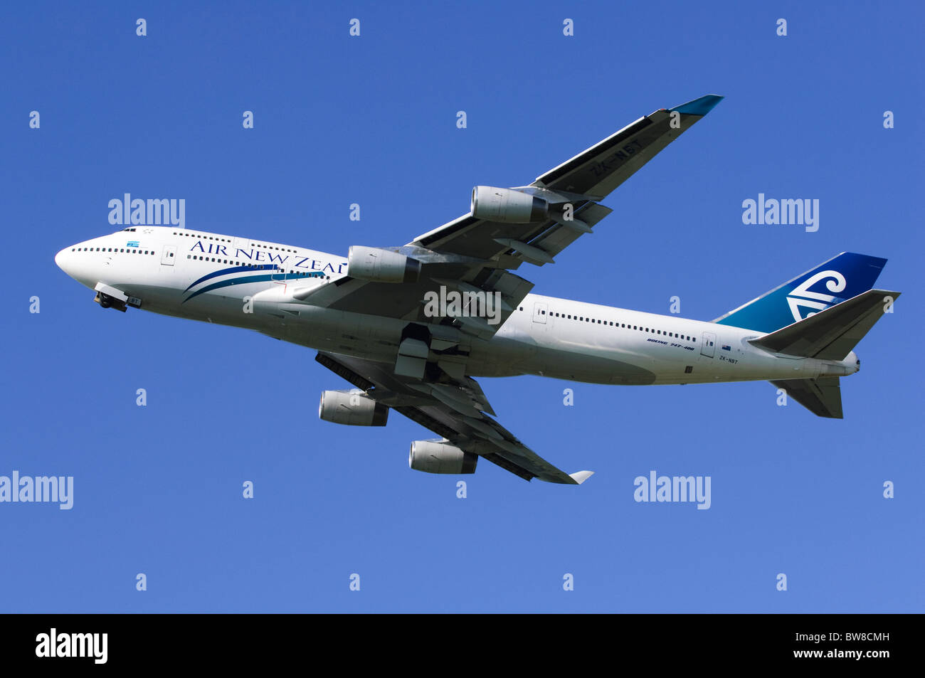 Boeing 747 operated by Air New Zealand climbing out after take off from London Heathrow Airport Stock Photo