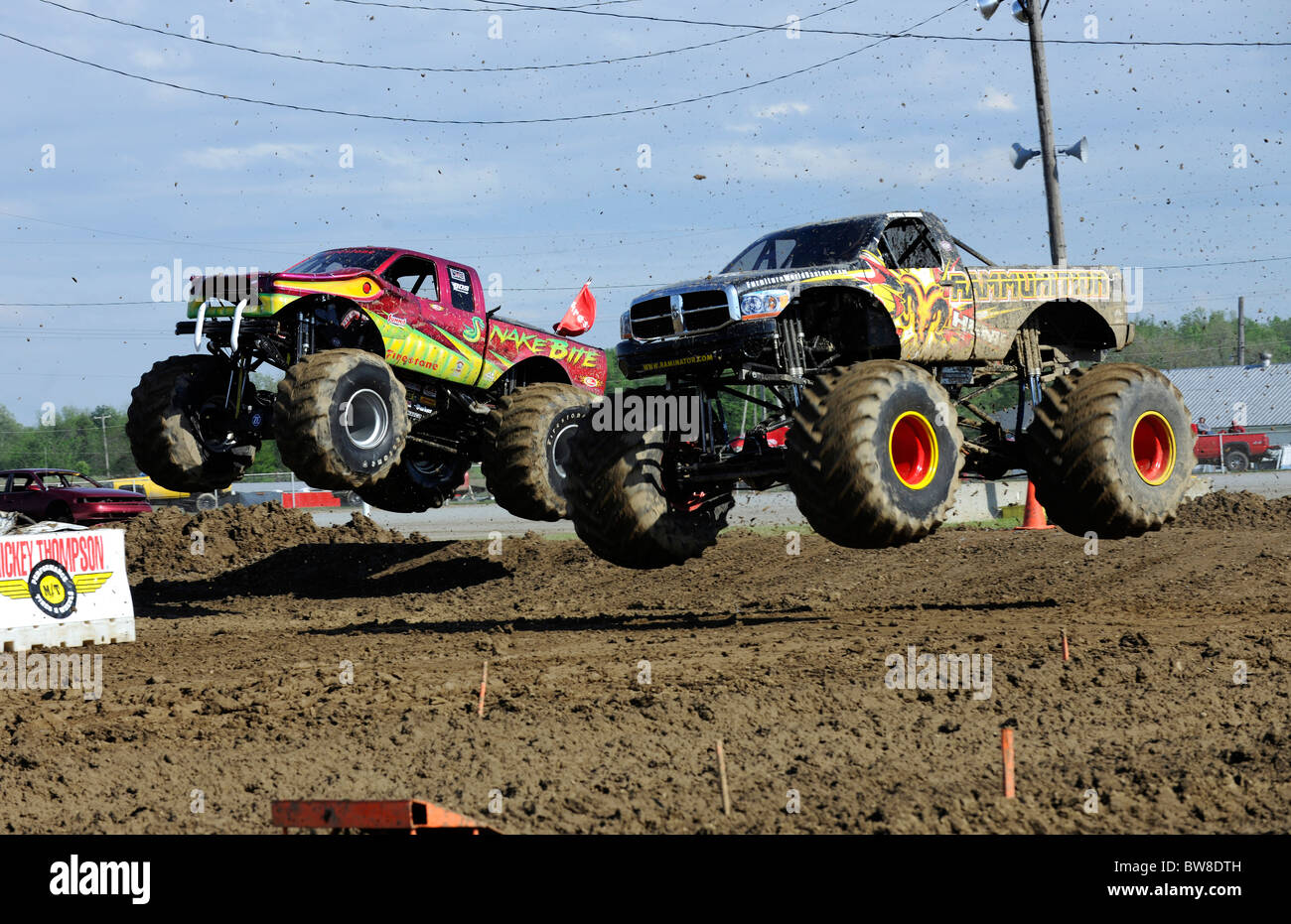 Monster Trucks race at freestyle competition at 4x4 Off-Road Jamboree Monster Truck Show at Lima, Ohio. Stock Photo