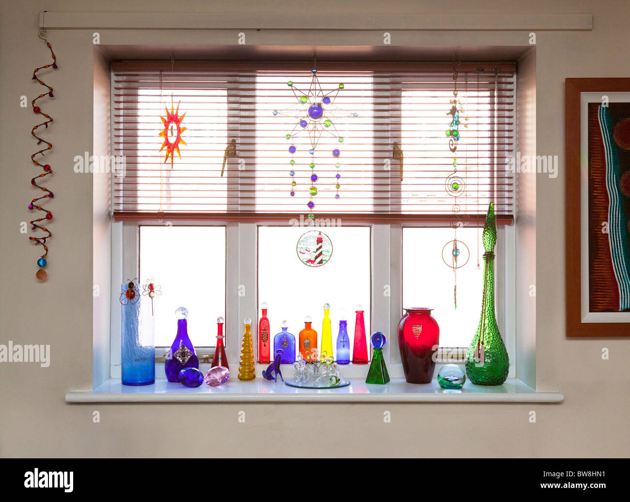 glass bottles on window ledge Stock Photo