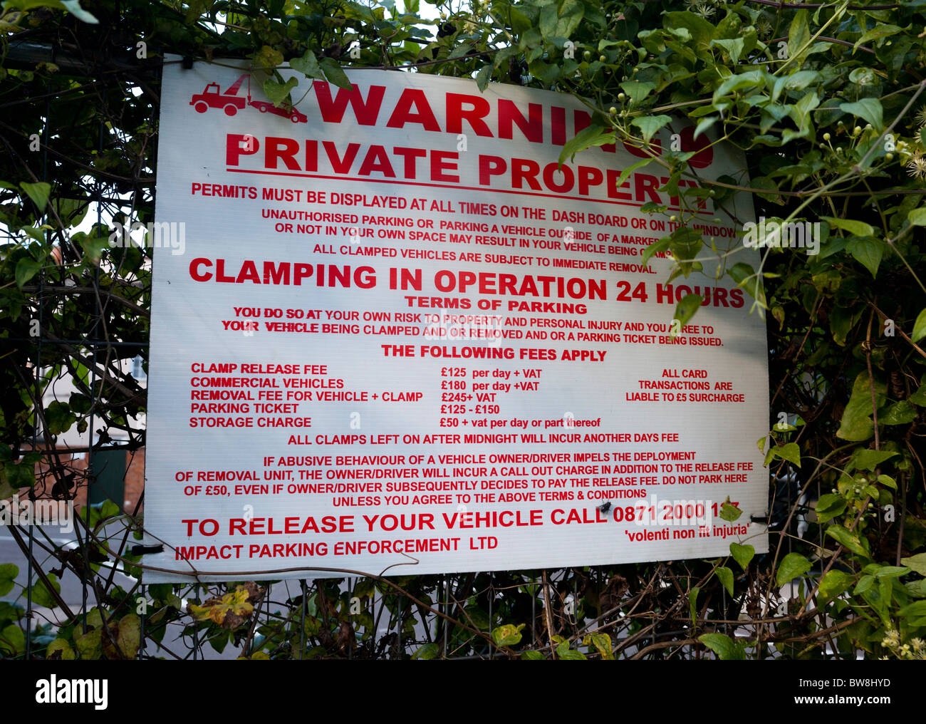 clamping warning sign in private car park in UK Stock Photo