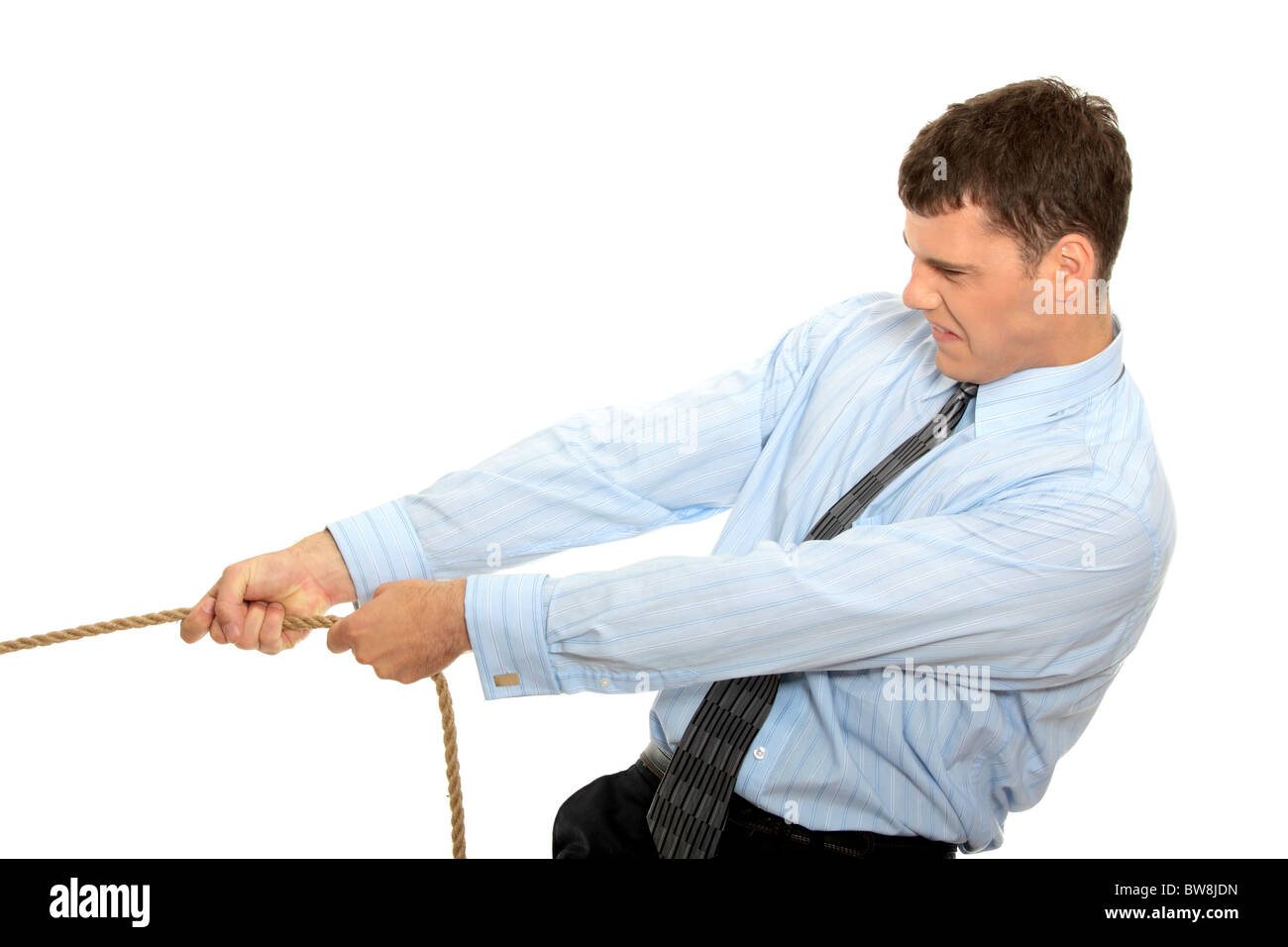 Businessman pulling on a piece of rope. Isolated on white Stock Photo ...