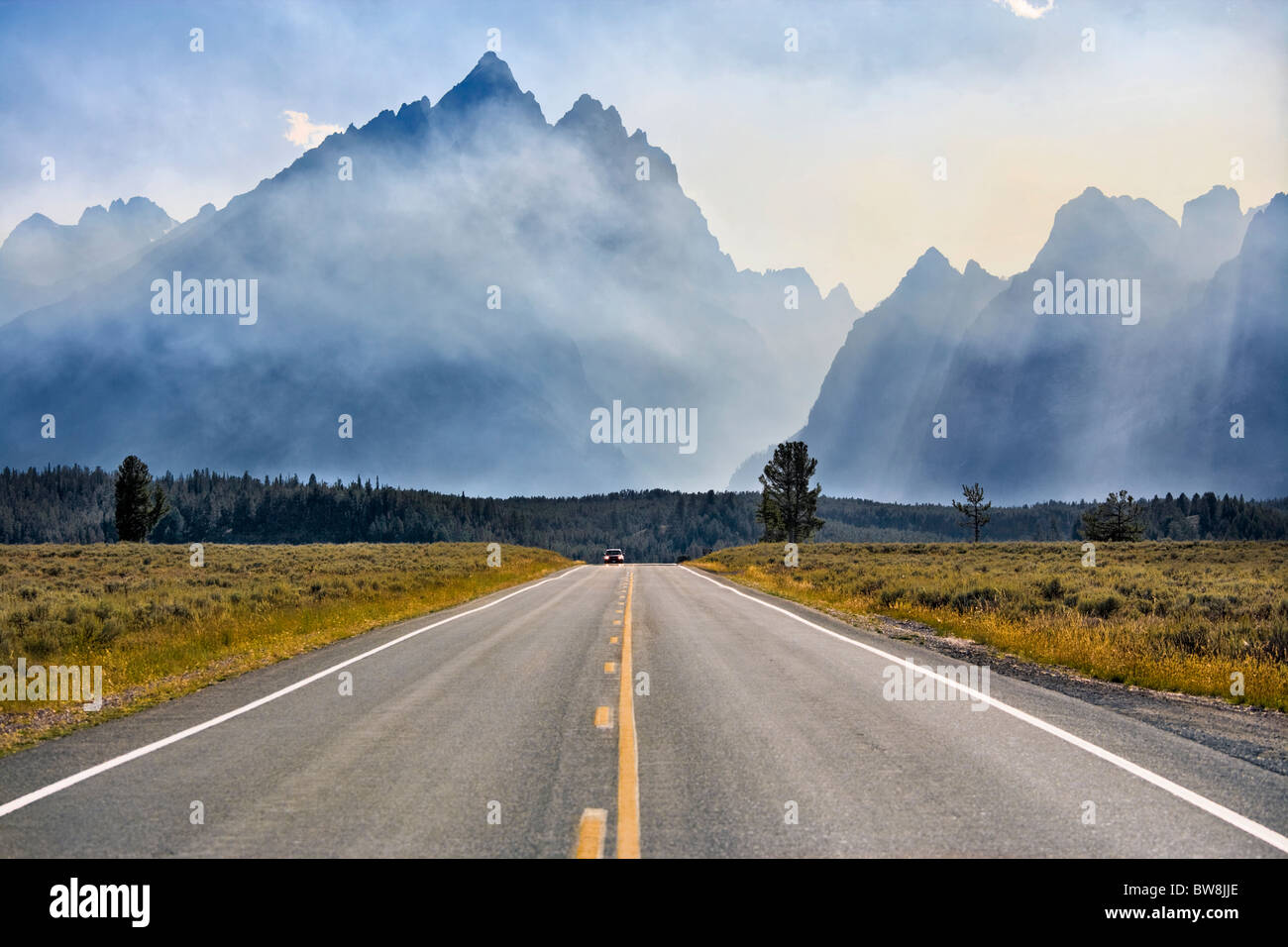 Mount Teton in Grand Teton National Park Wyoming. Jenny Lake Loop Road Scenic byway. Smoke from controlled fires. Stock Photo