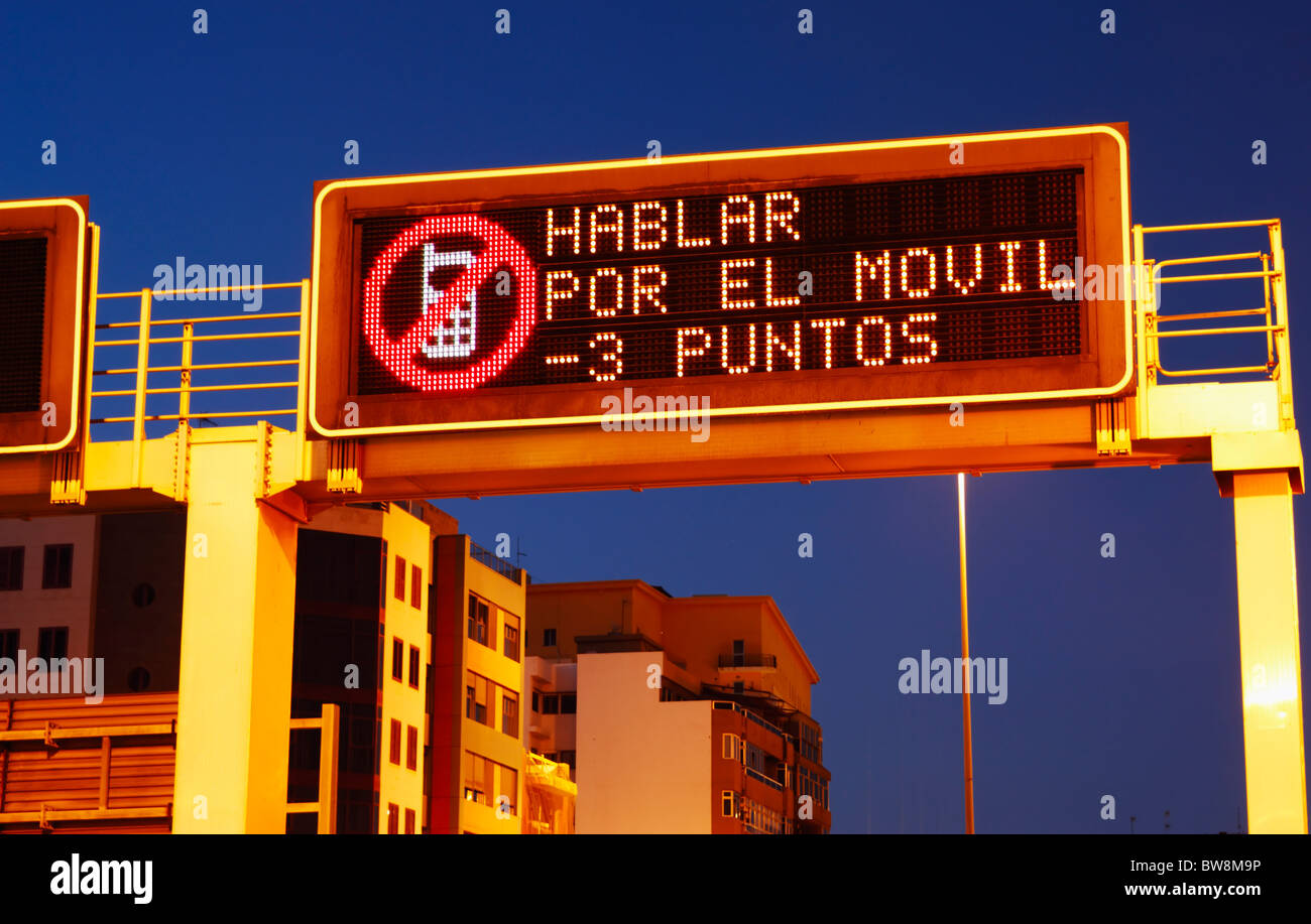Matrix display over road in Spain says 'hablar por el movil -3 puntos' ( 3 points for using mobile phone). Stock Photo